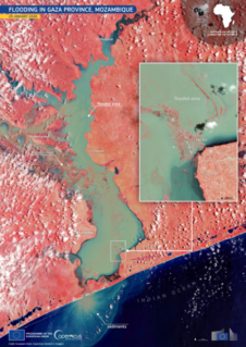 The Copernicus Sentinel-2 false-colour image of Gaza Province, Mozambique, acquired on 29 January 2026, aligns with the thematic of Floods and Wildfires by providing immediate impact maps that distinguish inundated areas in turquoise from healthy red vegetation, directly assisting the Copernicus Emergency Management Service and UNHCR in identifying disaster zones and organizing humanitarian aid for displaced populations.